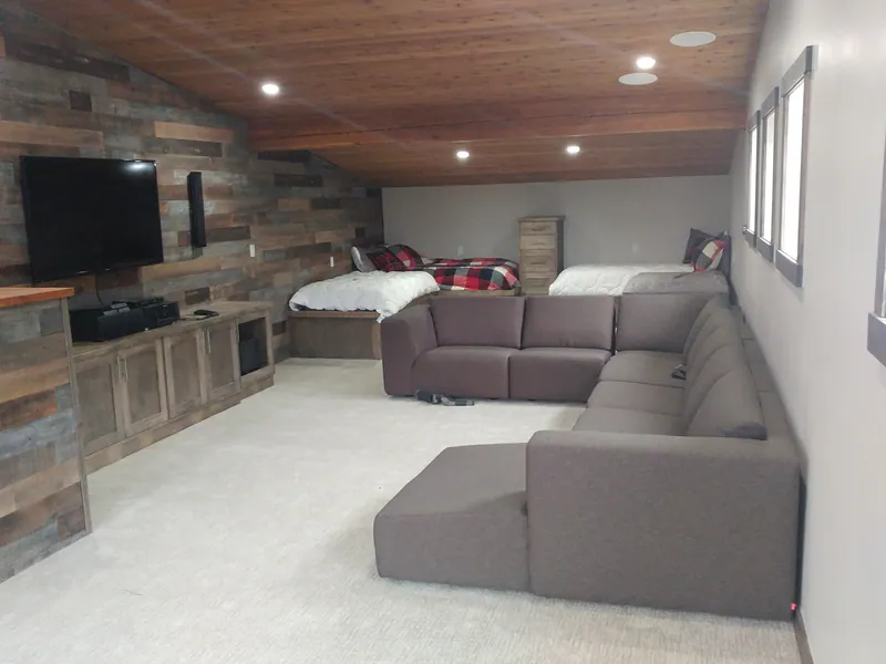 The loft with its living area, by Built Right in Montana