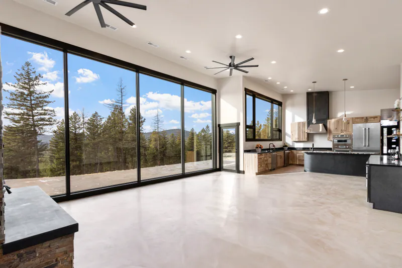 A large glass wall with Montana views in the Mountain Modern Living home