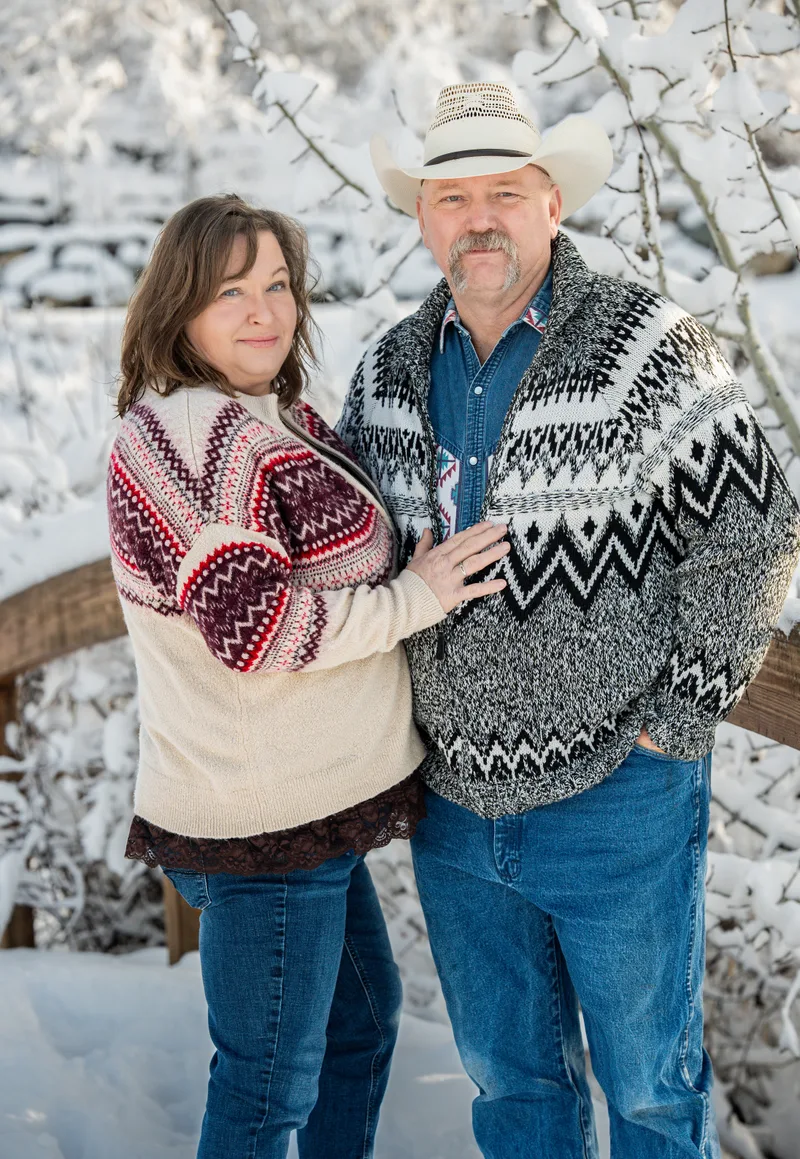 Shan and Carmen Davis, owners of Built Right in Montana, standing together in the snow